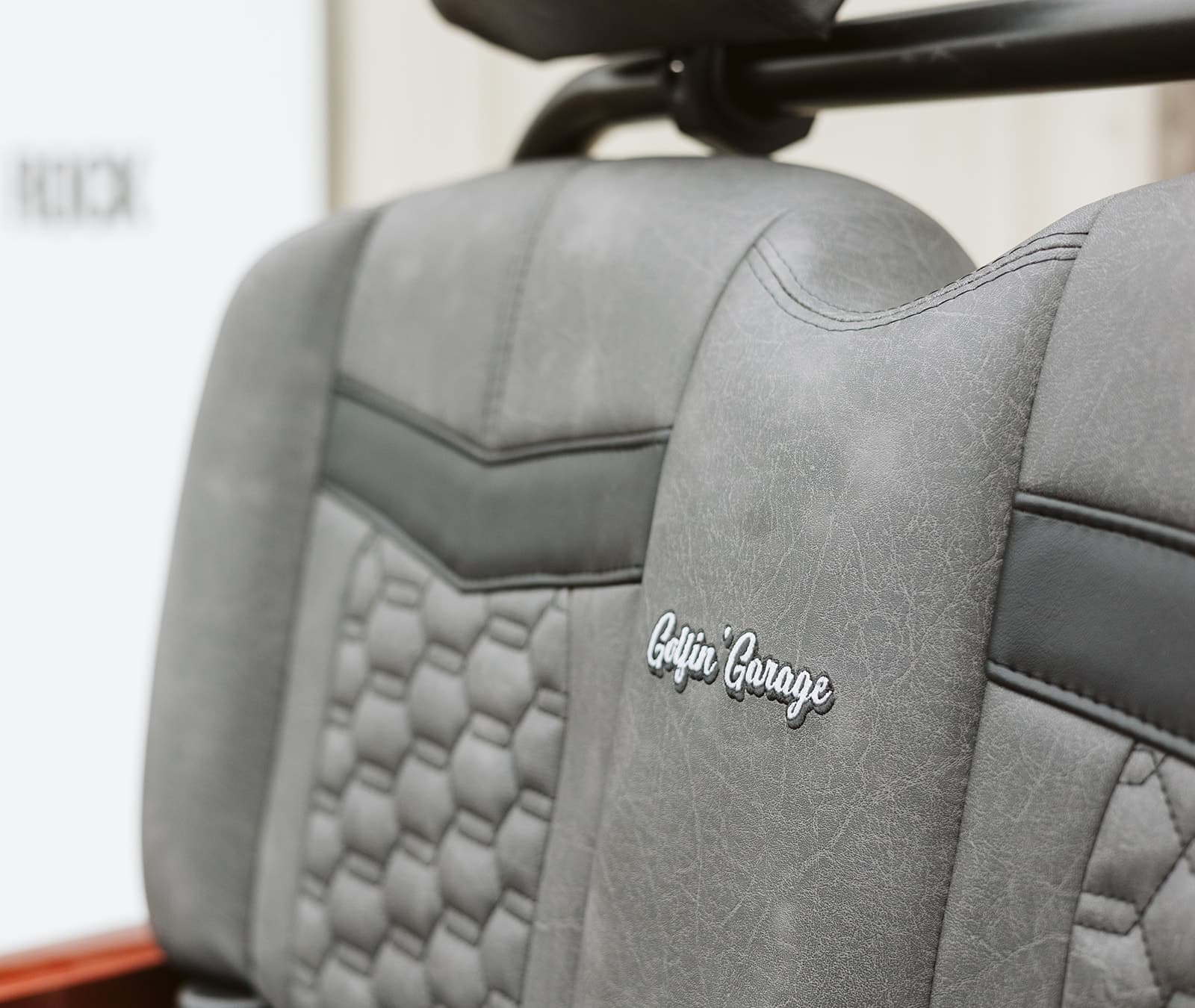 Hand-stitched Golfin' Garage embroidered leather seat