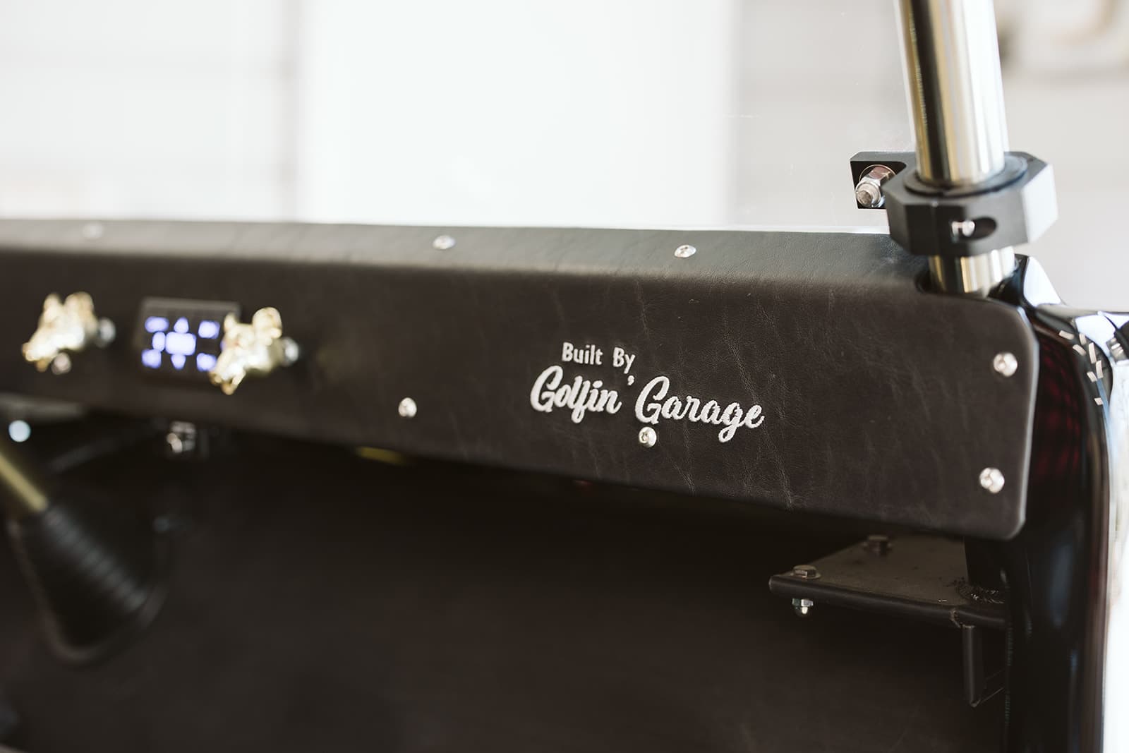 Built By Golfin' Garage — embossed leather interior detail